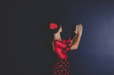woman in red dress dancing spanish flamenco 