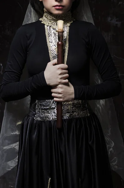 Woman in traditional armenian dress holding duduk in hands — ストック写真