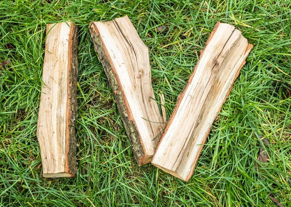 Roman numeral. Roman numerals made from oak. Old wood numbers. Old roman antique alphabet number on green grass background. Number four.