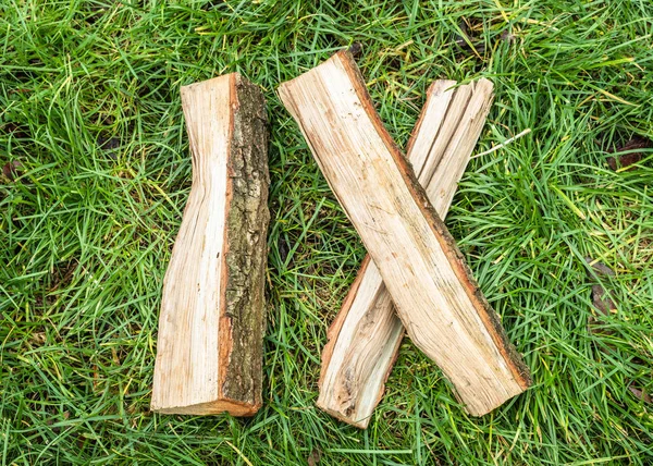 Roman numeral. Roman numerals made from oak. Old wood numbers. Old roman antique alphabet number on green grass background. Number nine.