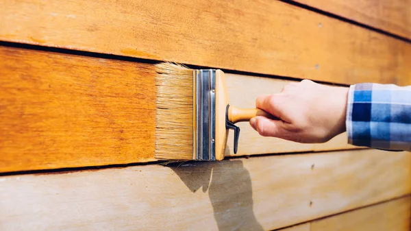 Female Hand Painting Wooden Wall Brush — Stock Photo, Image