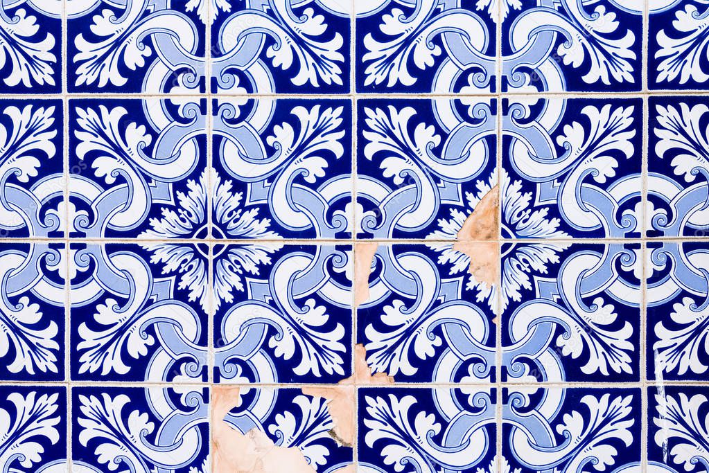 Traditional decoration of the facade of the house in Porto. Typical Portuguese and Spanish ceramic tiles azulejos