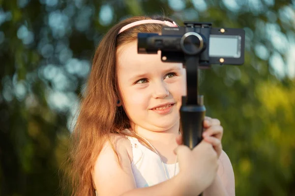 girl with a camera and stabilizer removes