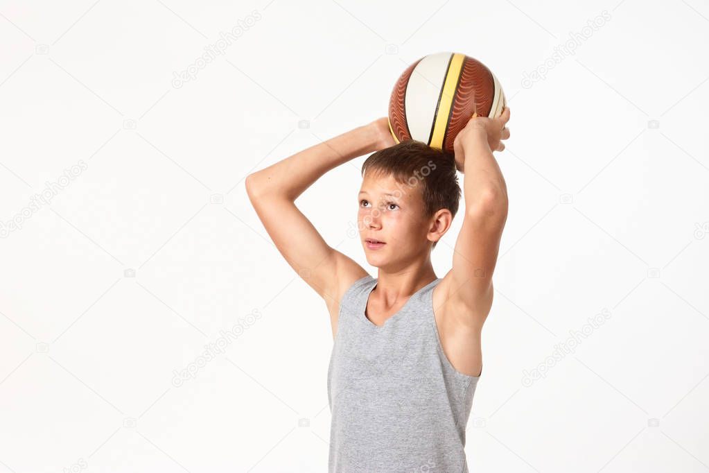 teenager with a basketball on a white background