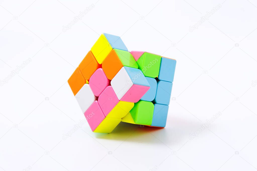 puzzle multi-colored cube on a white background isolate