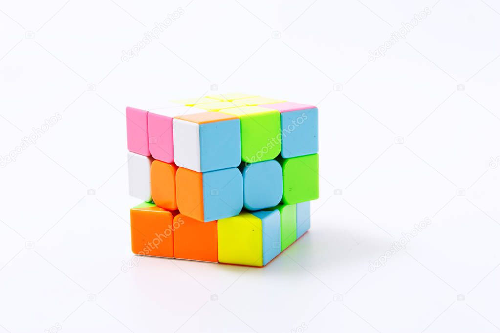 puzzle multi-colored cube on a white background isolate