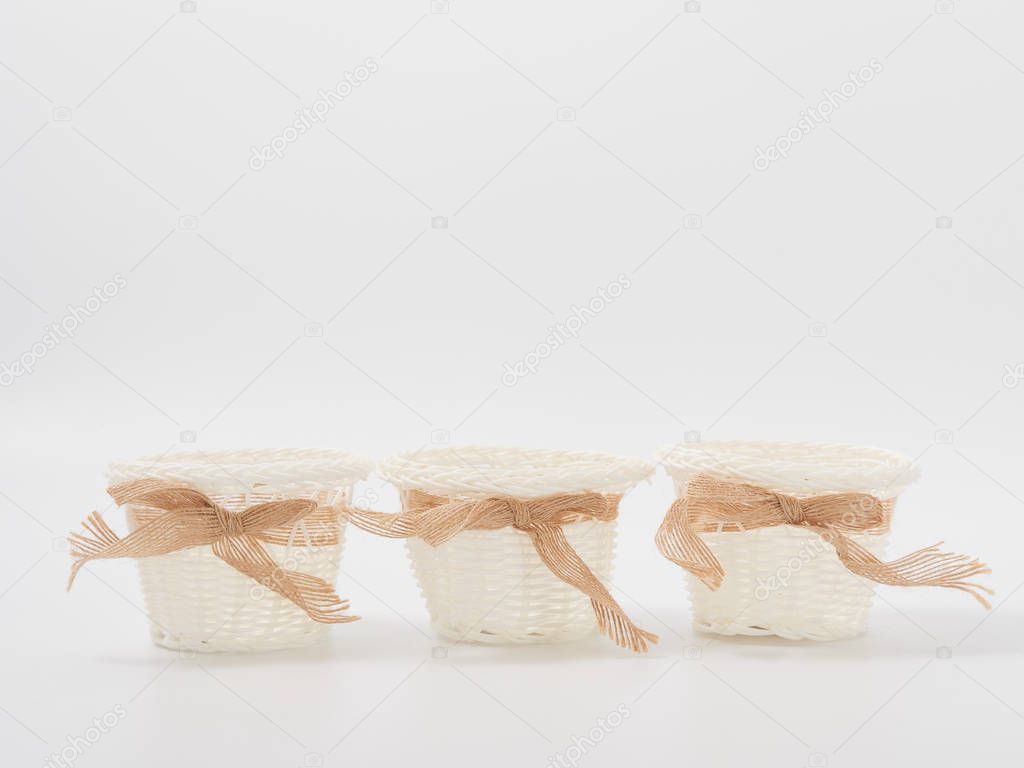 check miniature baskets of vines on a white background