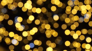 Yeni yıl gece aydınlatma renkli çalışan bokeh ışıklar.
