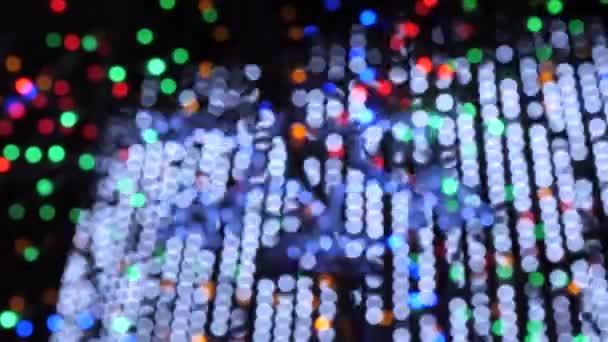 Colorful running bokeh lights in the new year night illumination. — Stock Video