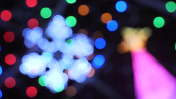 Colorful running bokeh lights in the new year night illumination. — Stock Video