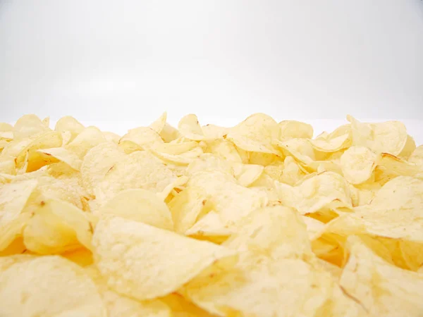 natural potato chips golden on a white background