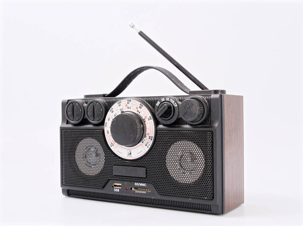 Retro black radio receiver with antenna and speakers.