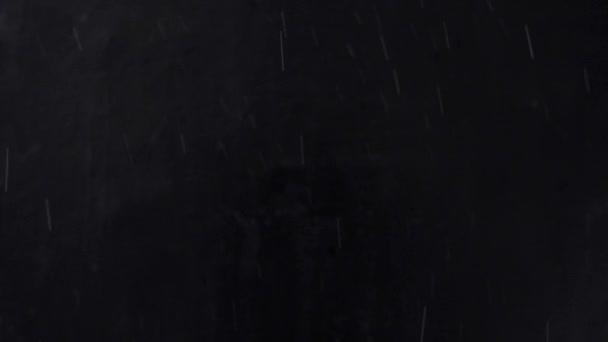 neige tombante blizzard sur fond noir .