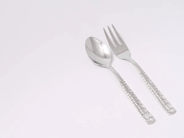 Gümüş çatal kaşık bıçak çatal beyaz bir arka plan üzerinde — Stok fotoğraf