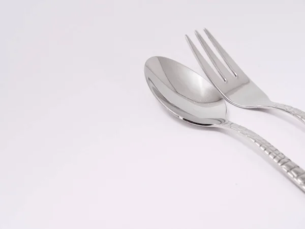 Silverware forks spoons knives cutlery on a white background — Stock Photo, Image