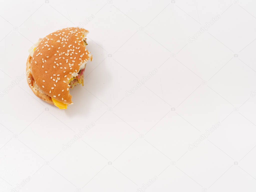 Overhead view of a bitten hamburger