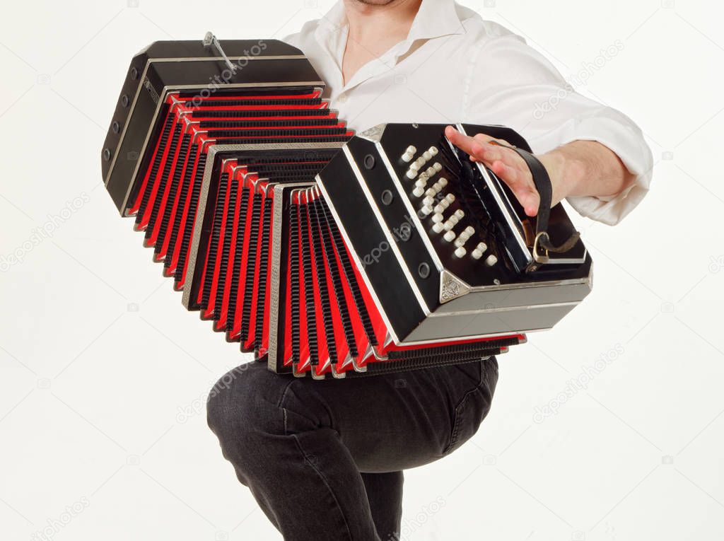 GOMEL, BELARUS - FEBRUARY 14, 2019: a bandoneon musical instrument in the hands of a musician