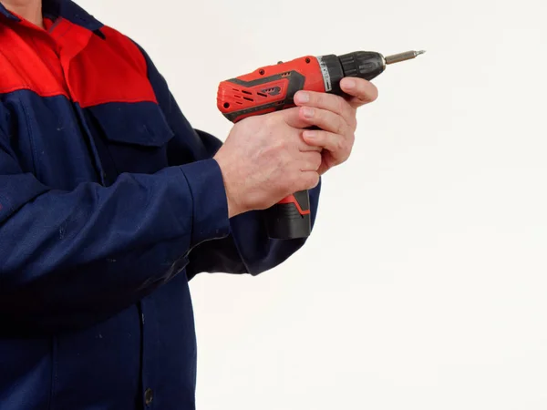 Hombre Ropa Trabajo Sostiene Una Herramienta Taladro Sobre Fondo Blanco —  Fotos de Stock