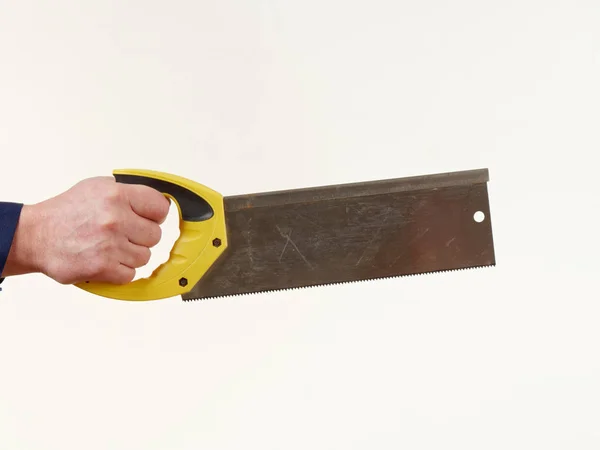 Man Werkkleding Houdt Een Handzaag Tool Witte Achtergrond — Stockfoto