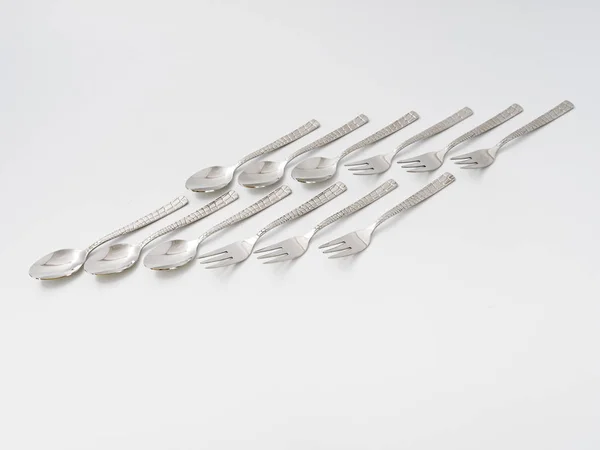 Cutlery forks and spoons on a white background — Stock Photo, Image