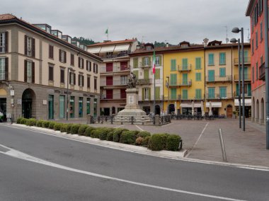 Sarnico, ITALY - August 7, 2019: Lake ISEO. Beautiful houses on a city street clipart