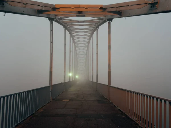 foot bridge in the fog in the fall. Gomel, Belarus