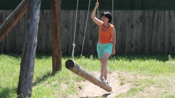 Woman Village Riding Swing — Stock Video