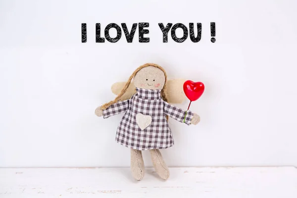 Little angel doll with a balloon heart and a I love you text