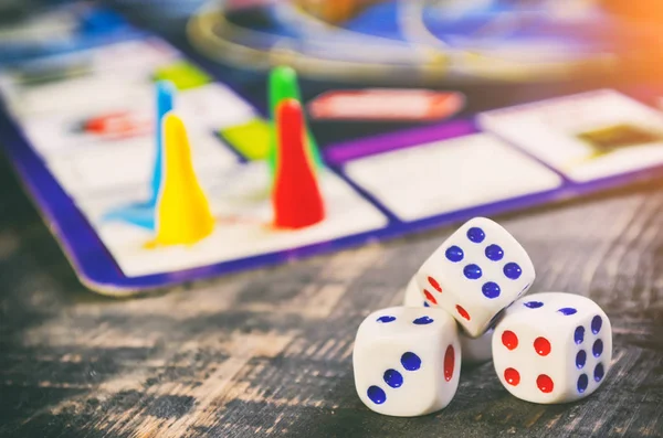 board game with white cubes on a wooden table