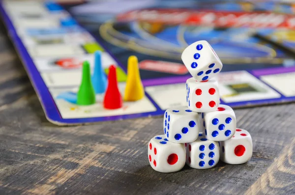 board game with white cubes on a wooden table