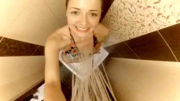 Happy girl is standing in a shower. The concept of a healthy lifestyle — Stock Video