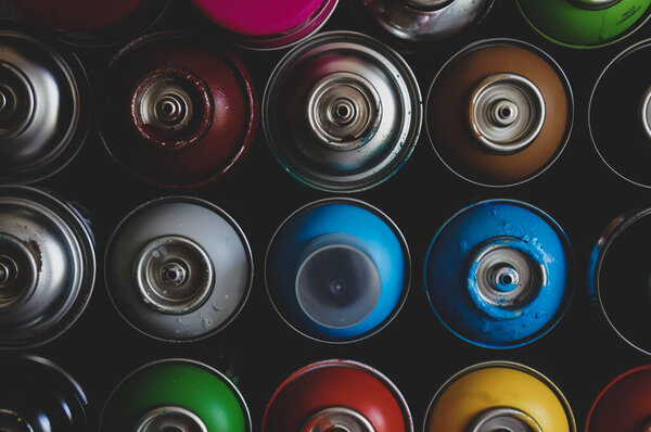 texture of multi-colored spray cans with paint for graffiti, for background and screen saver