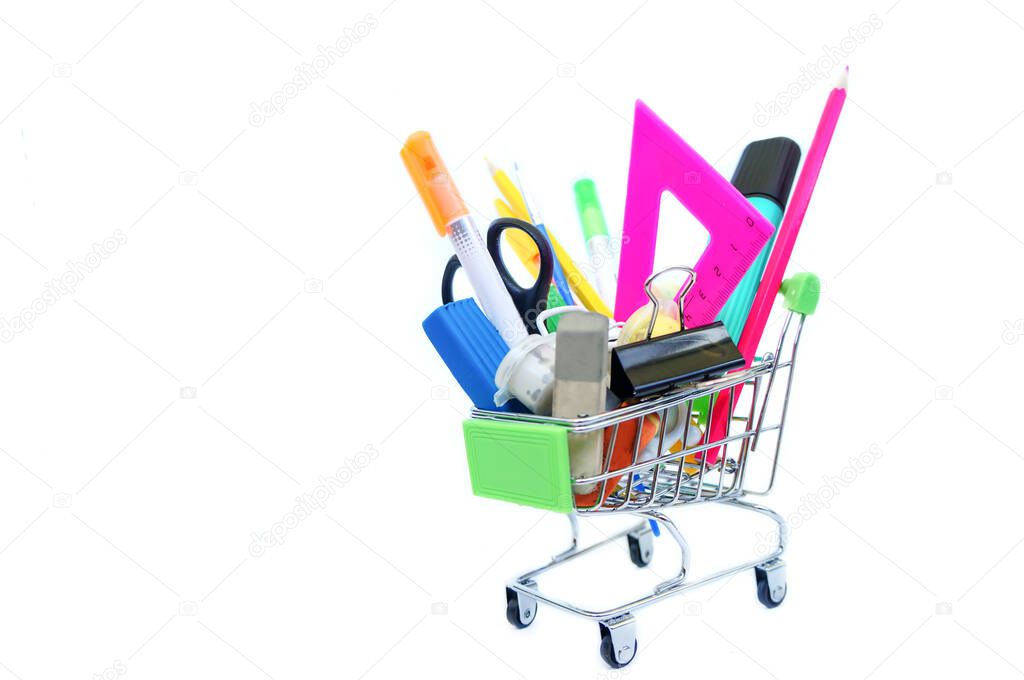 school supplies in trolley from supermarket on white isolated background