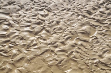 Islak ince kumun soyut arkaplanı 