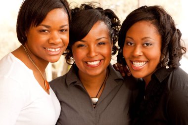 Happy African American women laughing and smiling. clipart