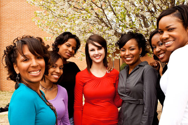 Diverse group of friends talking and laughing.