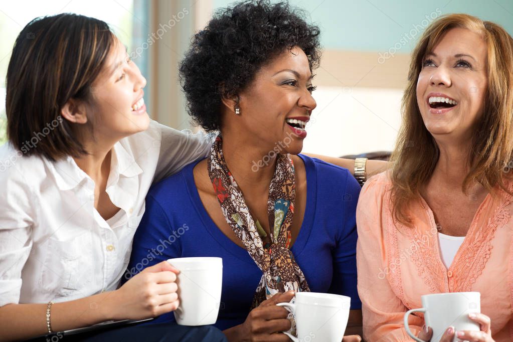 Diverse group of friends talking and laughing.