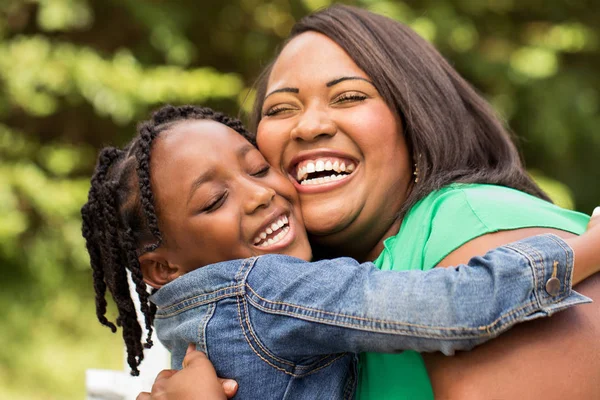 Happy African American mother and daughter. — Stock Photo, Image