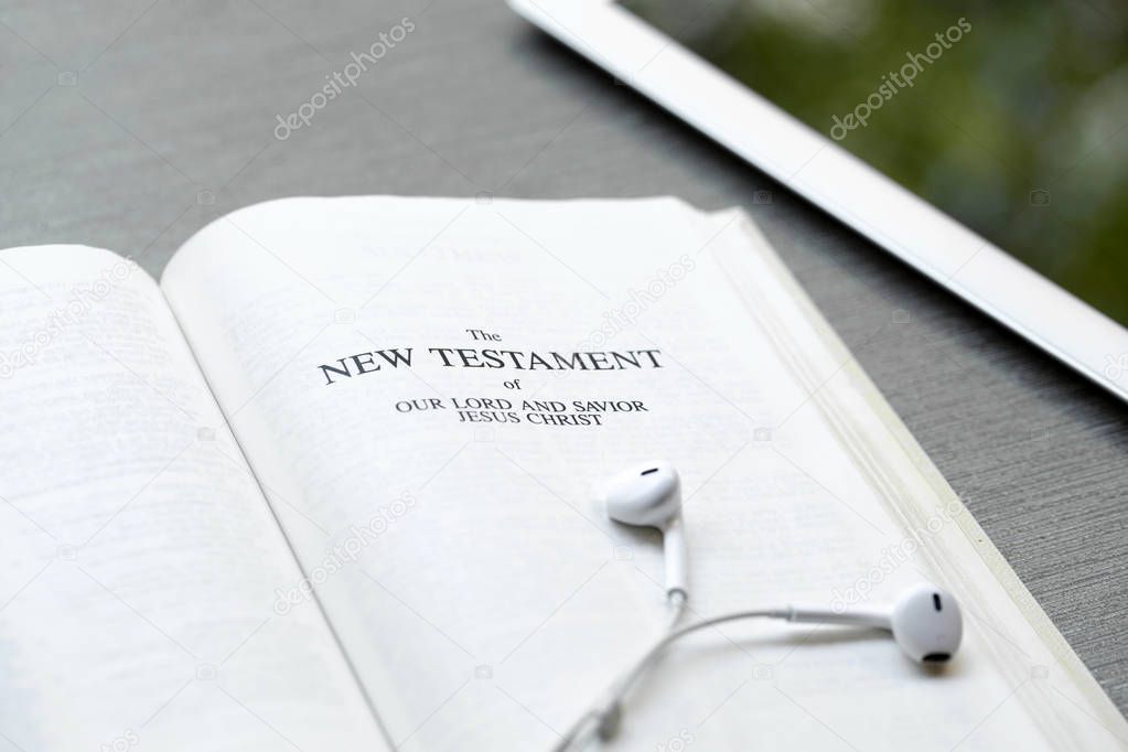 Christian background of a Bible and ipad.