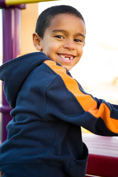 Menino bonito em um slide . — Fotografia de Stock