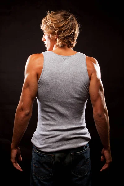 Handsome young muscular man isolated.