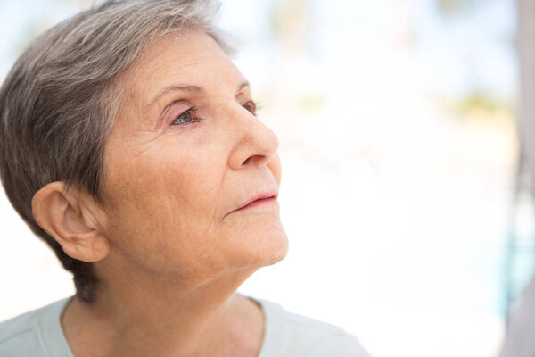 Portrait of a mature elderly woman smiling.