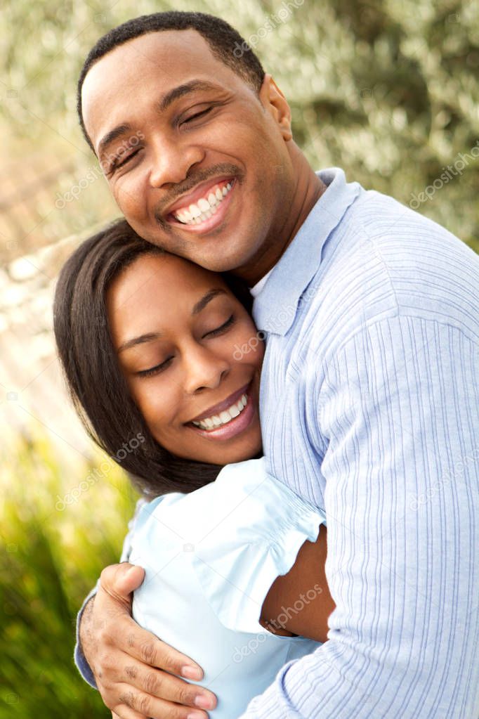 Portrait of a Happy African American couple smiling and hugging.