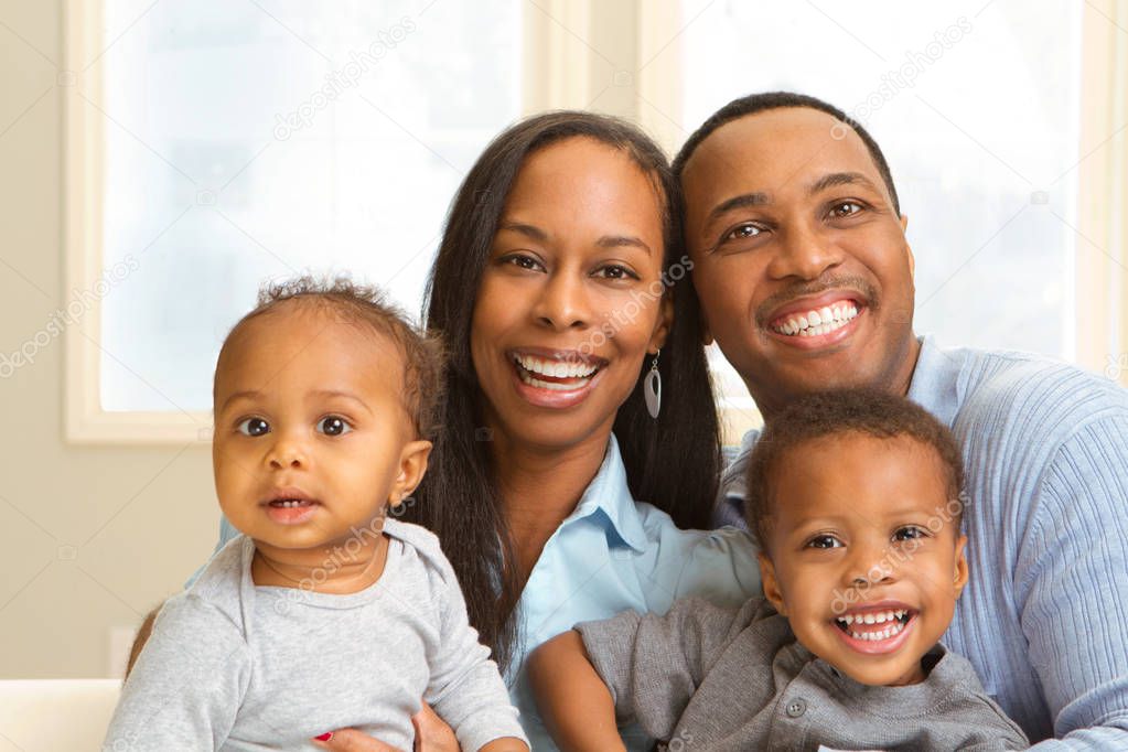 Portrait of a young African American young family.