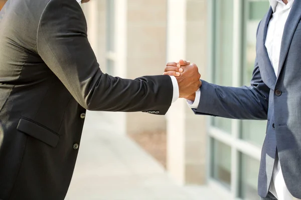 Mature African American casually dressed businessman shaking hands. — Stock Photo, Image