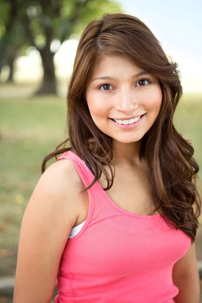 Young Hispanic girl smiling outside. — Stock Photo, Image