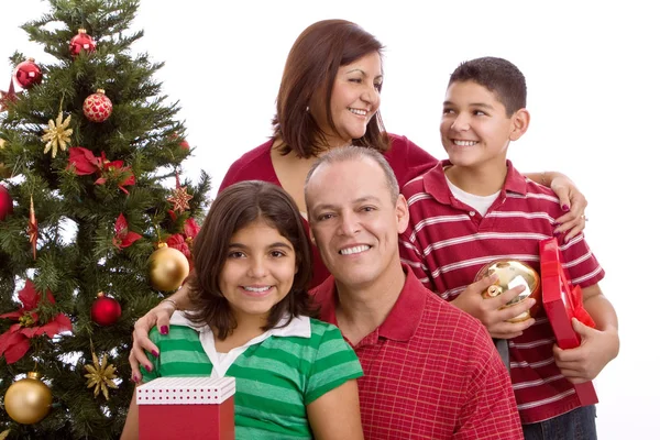 Feliz familia hispana en Navidad intercambiando regalos . — Foto de Stock
