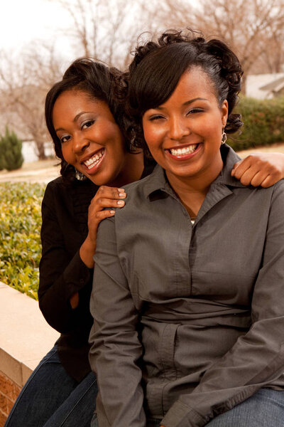 Happy African American women laughing and smiling.