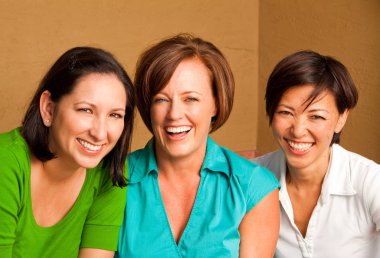 Diverse group of friends talking and laughing. clipart