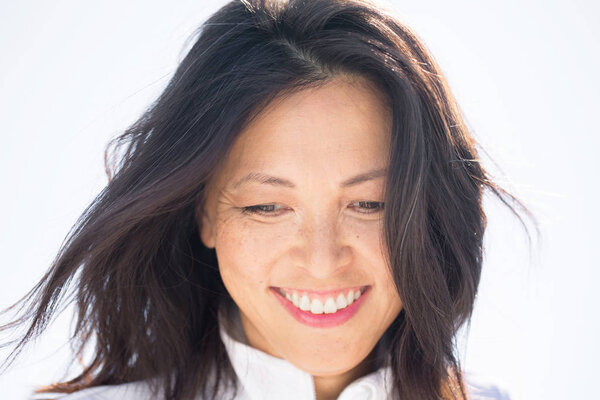 Portrait of a beautiful Asian woman smiling.